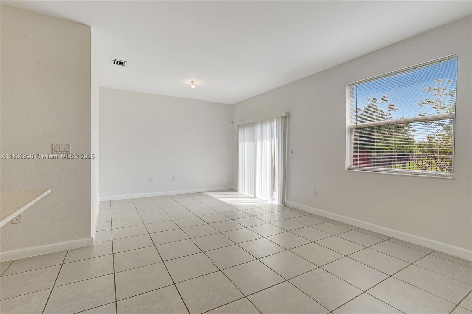 Gladeview Miami, FL 33147 - Photo 15 of 42 a view of an empty room with a window