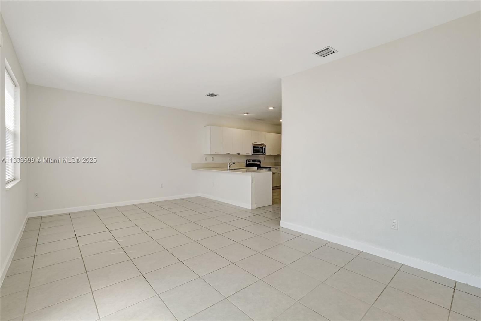 Gladeview Miami, FL 33147 - Photo 17 of 42 a view of a kitchen with white cabinets