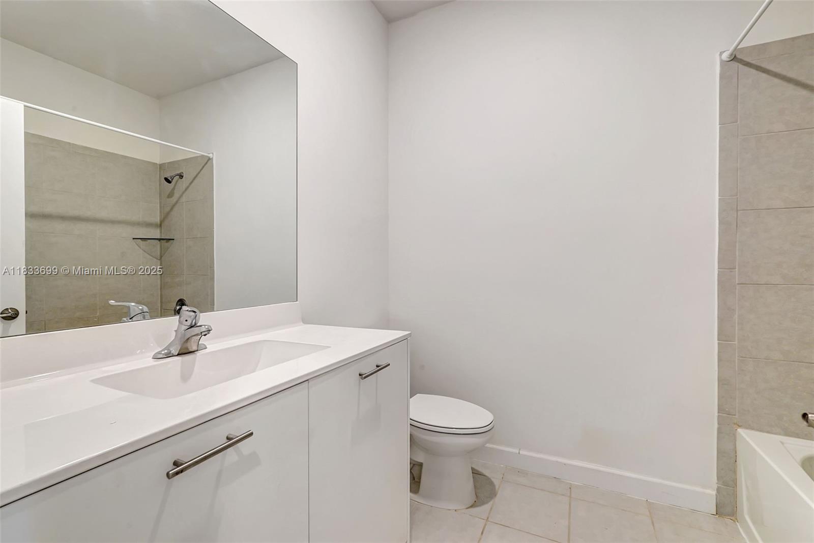 Gladeview Miami, FL 33147 - Photo 21 of 42 a bathroom with a sink toilet and a mirror