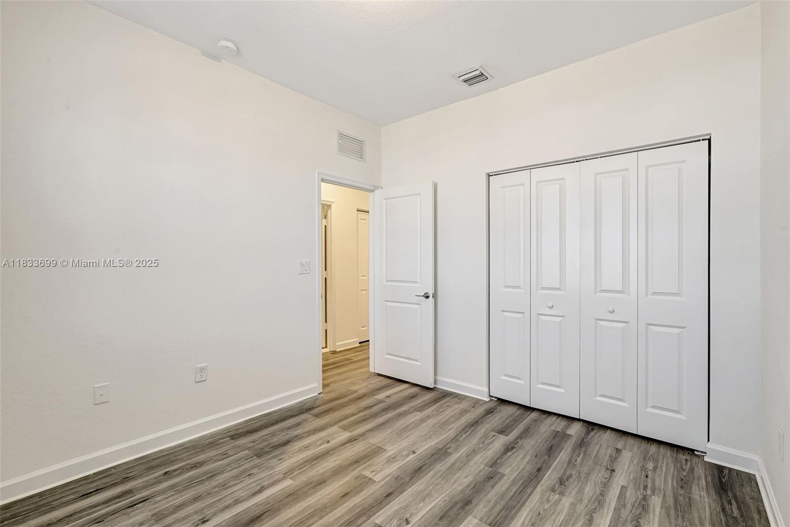 Gladeview Miami, FL 33147 - Photo 25 of 42 a view of an empty room with closet and a window