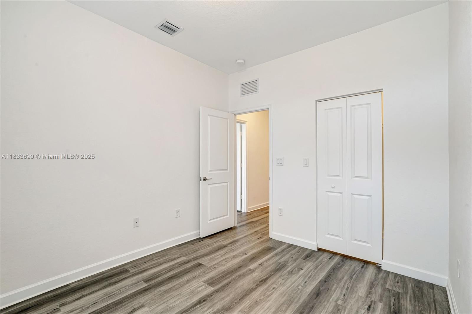 Gladeview Miami, FL 33147 - Photo 27 of 42 a view of an empty room with wooden floor