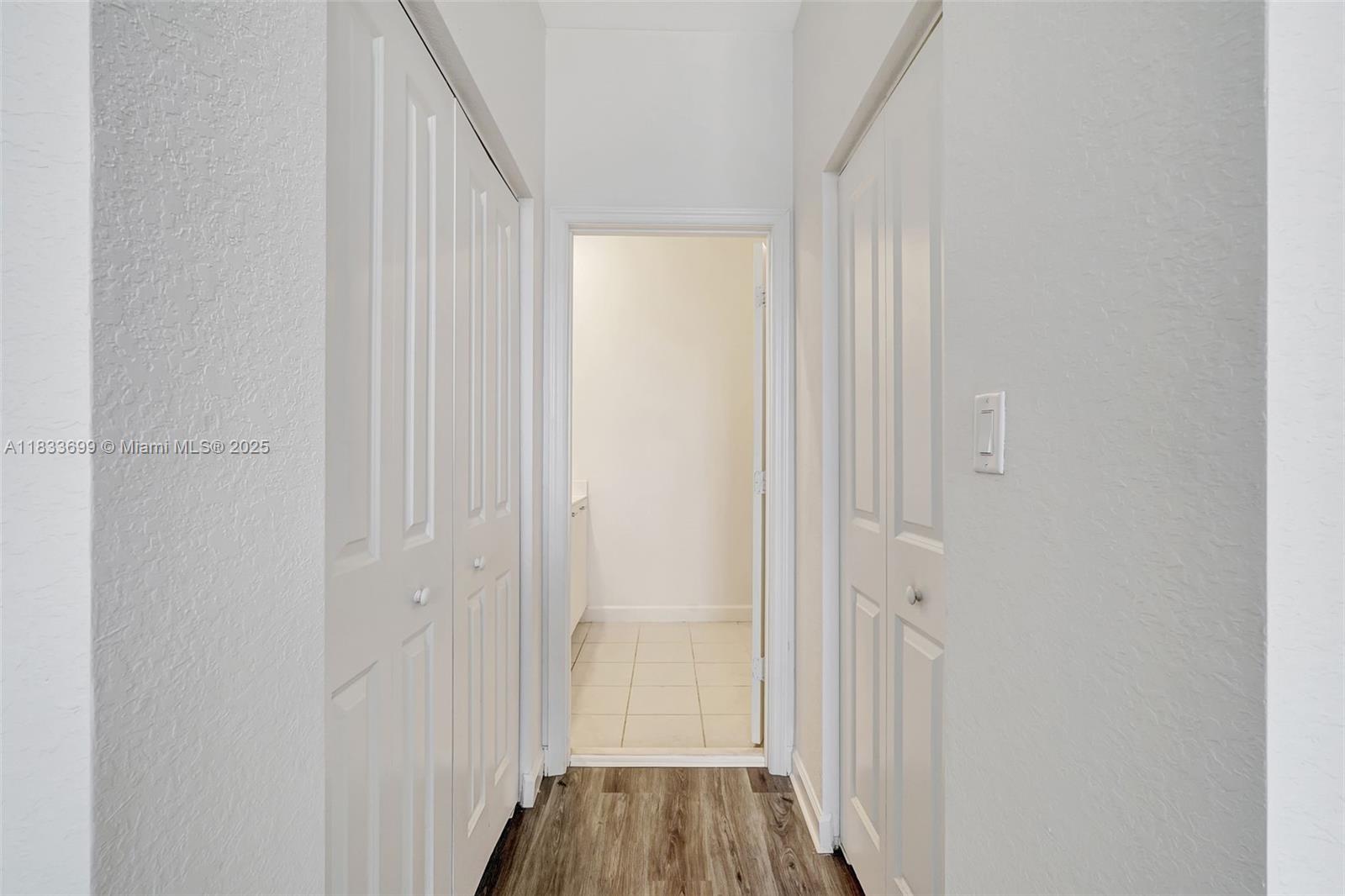 Gladeview Miami, FL 33147 - Photo 34 of 42 a view of a hallway with wooden floor