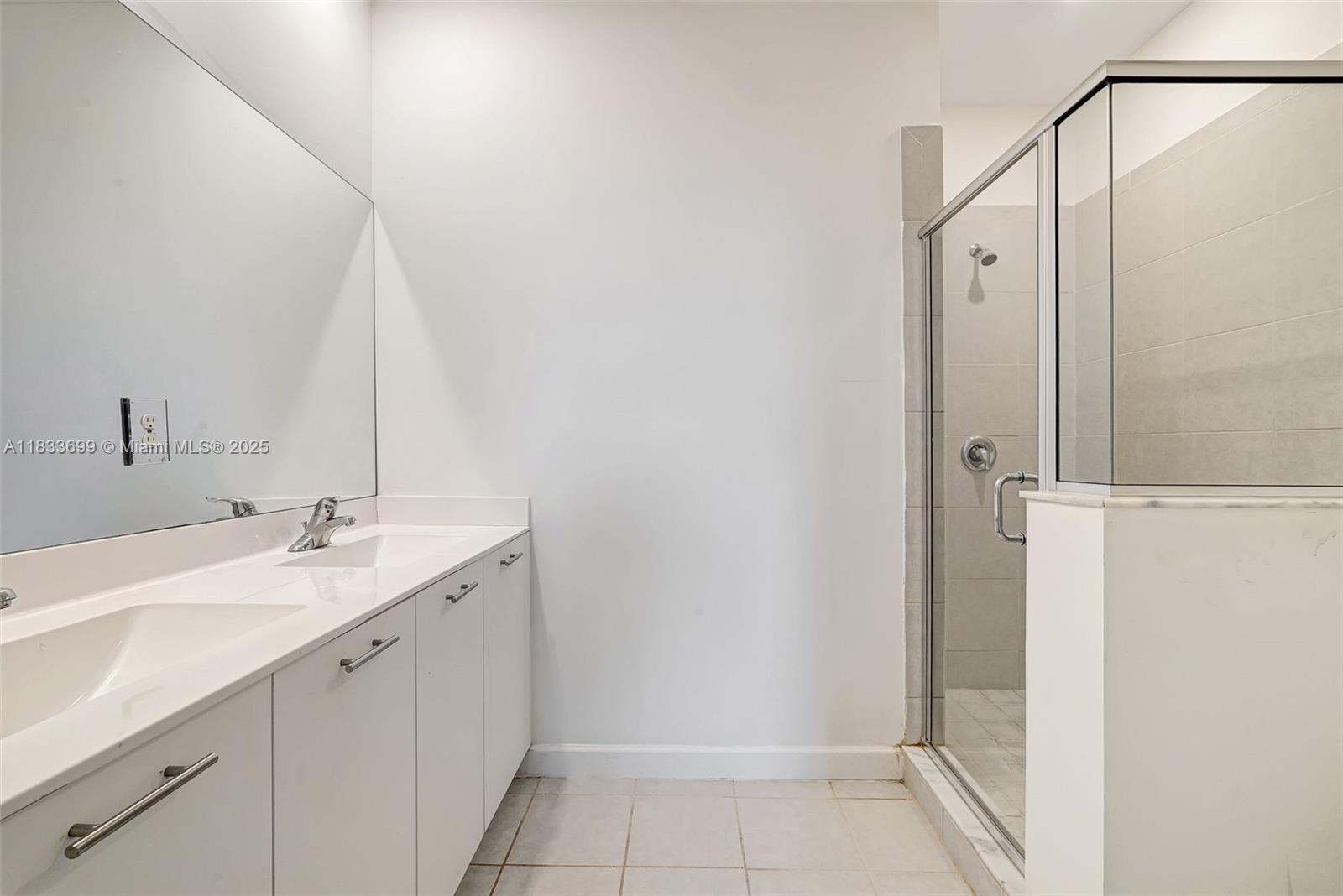 Gladeview Miami, FL 33147 - Photo 38 of 42 a bathroom with a sink and a mirror