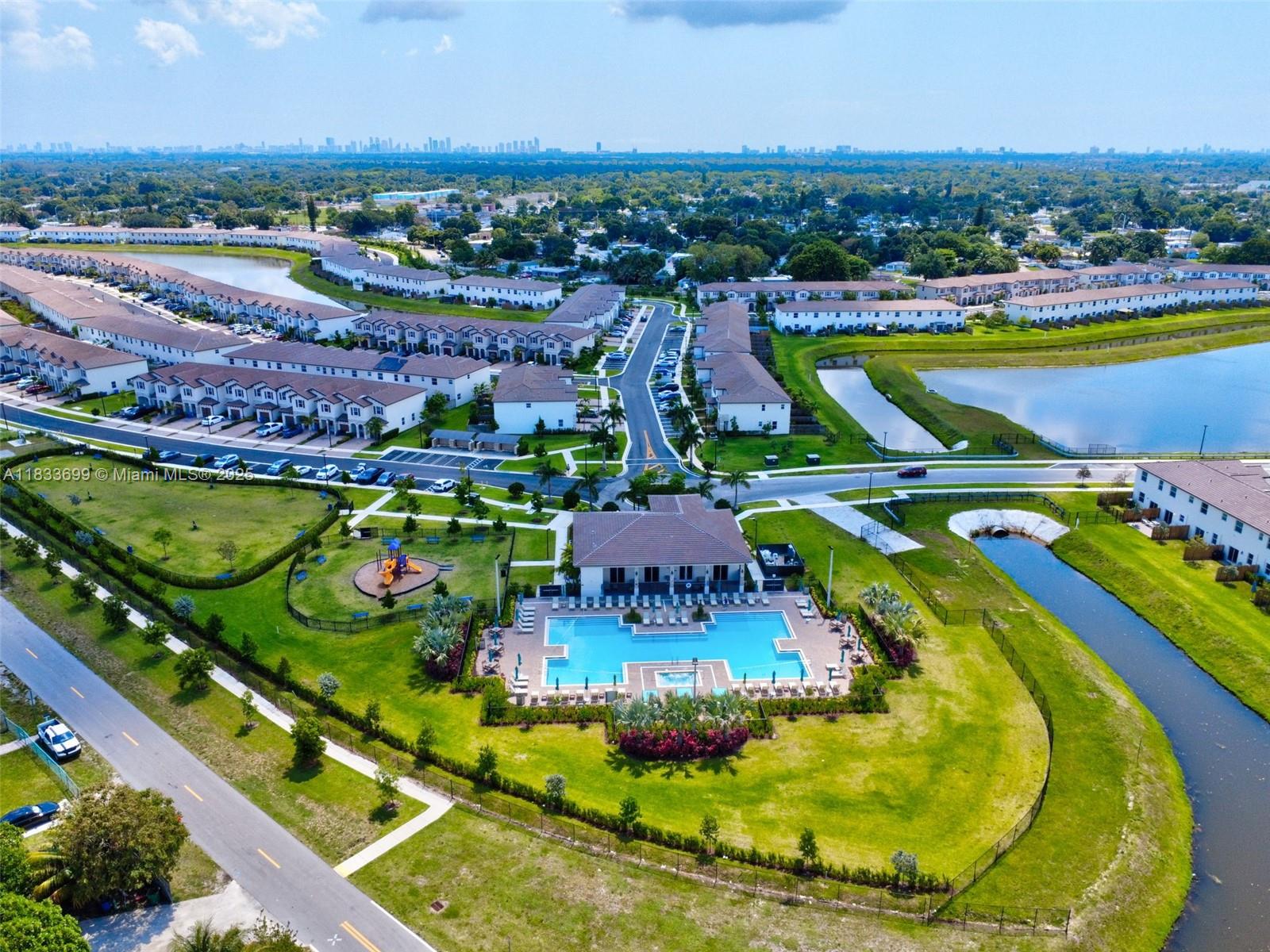 Gladeview Miami, FL 33147 - Photo 42 of 42 a view of a swimming pool with a table and chairs