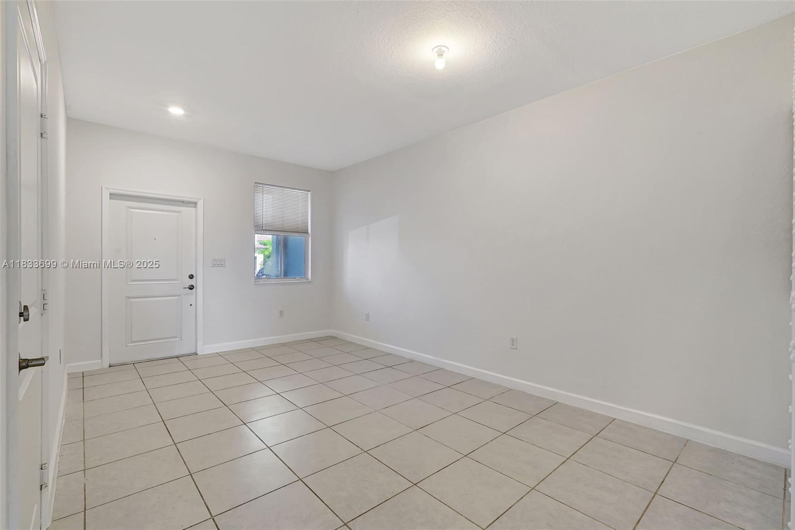 Gladeview Miami, FL 33147 - Photo 6 of 42 an empty room with white cabinet and mirror