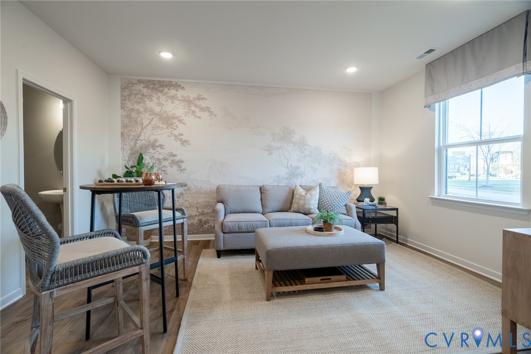 418 Quiet Breeze Alley, Unit 281 Midlothian, VA 23113 - Photo 3 of 27 a bedroom with furniture and a window