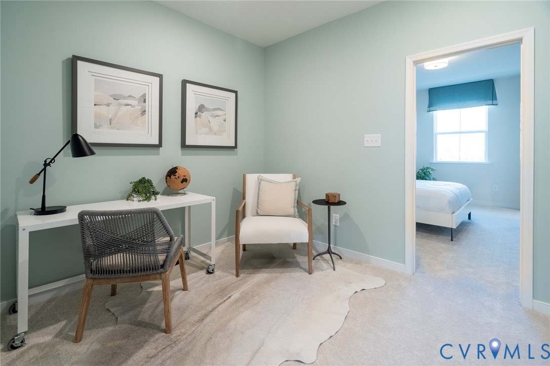 418 Quiet Breeze Alley, Unit 281 Midlothian, VA 23113 - Photo 5 of 27 a living room with furniture and a chair