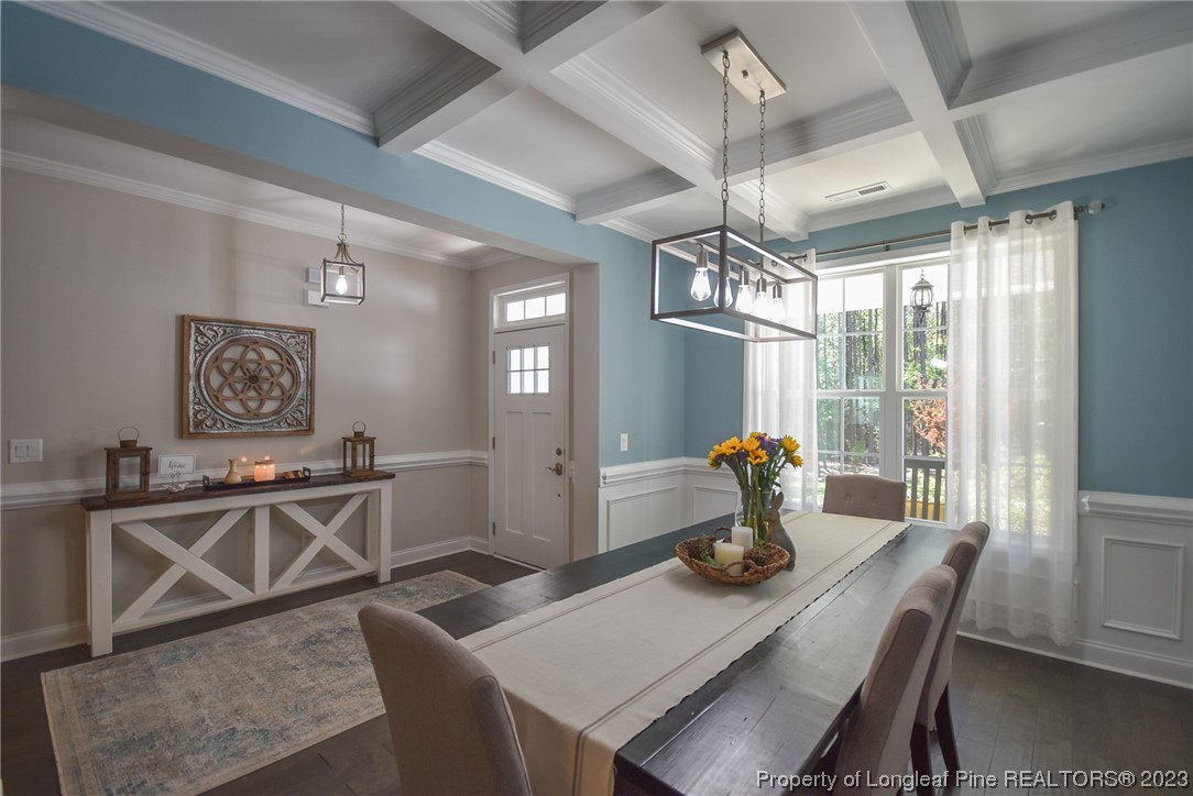 515 Bristling Pine Road Carthage, NC 28327 - Photo 13 of 40 a view of a dining room with furniture window and wooden floor
