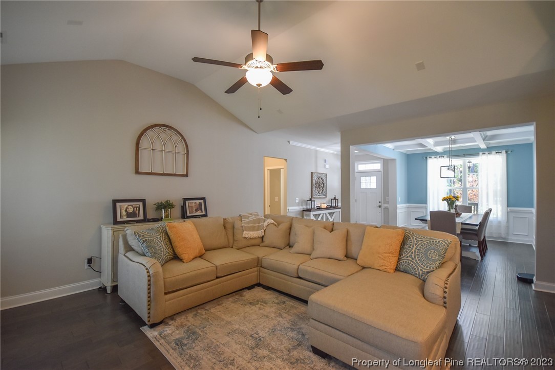 515 Bristling Pine Road Carthage, NC 28327 - Photo 16 of 40 a living room with furniture and a chandelier