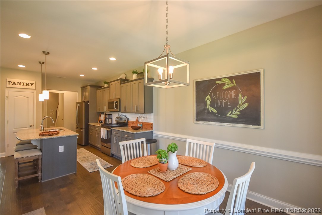 515 Bristling Pine Road Carthage, NC 28327 - Photo 23 of 40 a dining room with furniture and window
