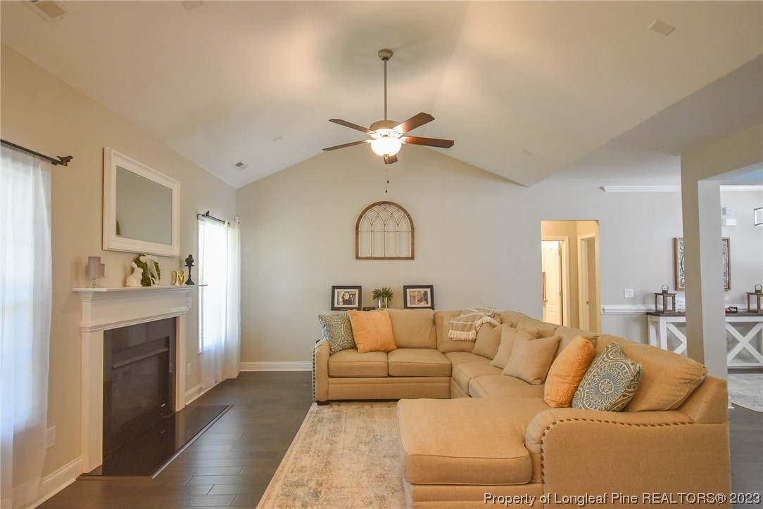 515 Bristling Pine Road Carthage, NC 28327 - Photo 24 of 40 a living room with furniture fireplace and window