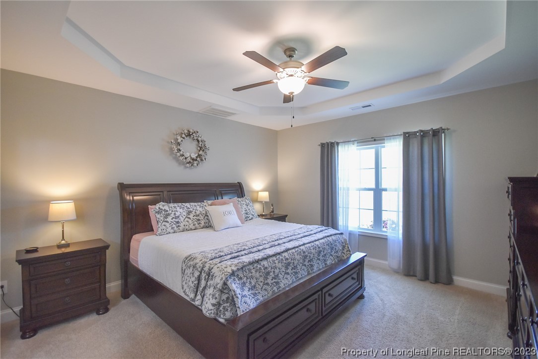 515 Bristling Pine Road Carthage, NC 28327 - Photo 25 of 40 a bedroom with a bed and window