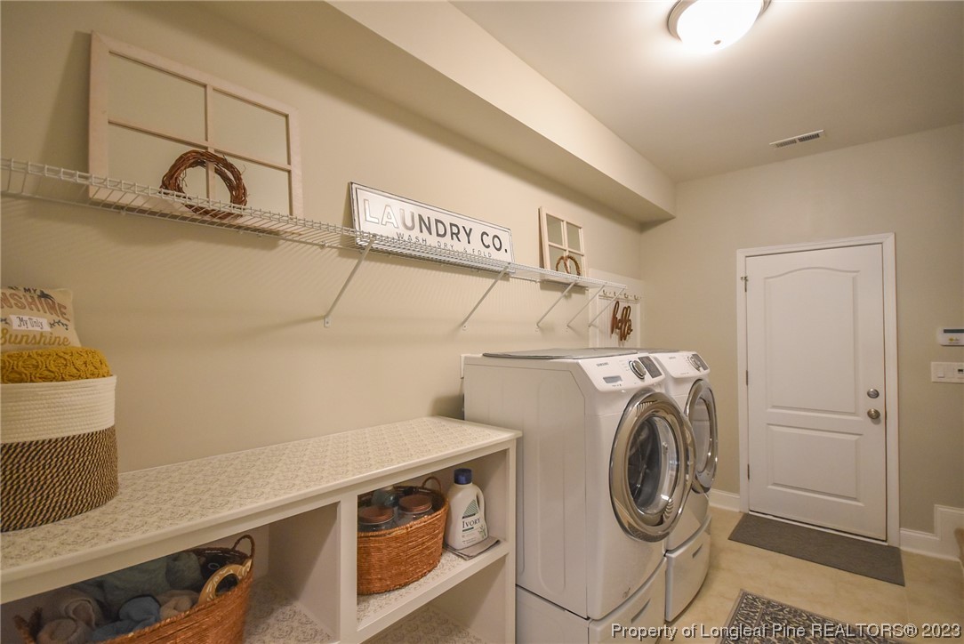 515 Bristling Pine Road Carthage, NC 28327 - Photo 36 of 40 a utility room with dryer and washer