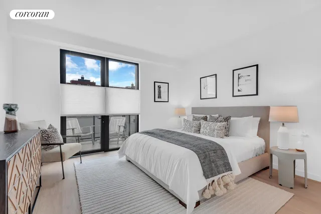 a bathroom with a double vanity sink a mirror and a bathtub
