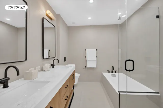 a bedroom with a bed and flat screen tv