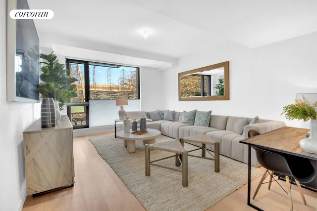 a view of a terrace with couches and a potted plant on wooden floor