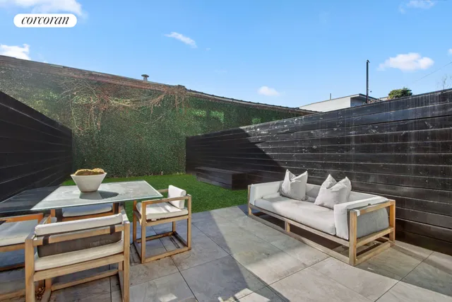 a bedroom with a bed and a night stand