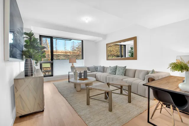 a kitchen with a table chairs sink and cabinets