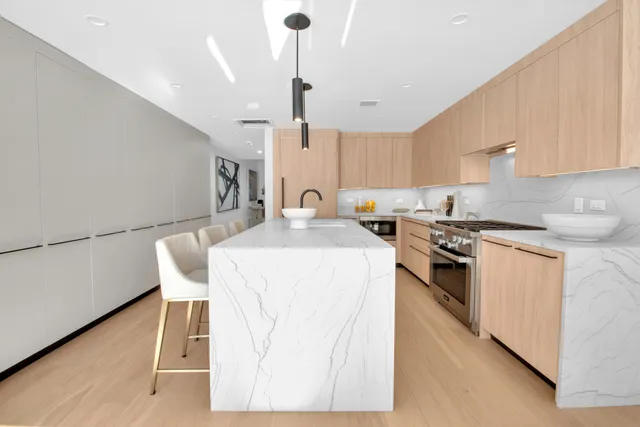 a living room with dining table and chairs