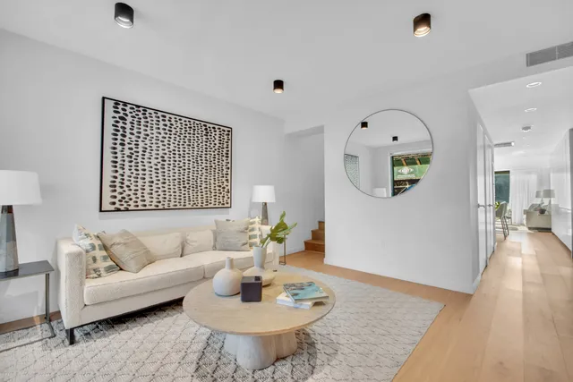 a bedroom with a bed and glass door