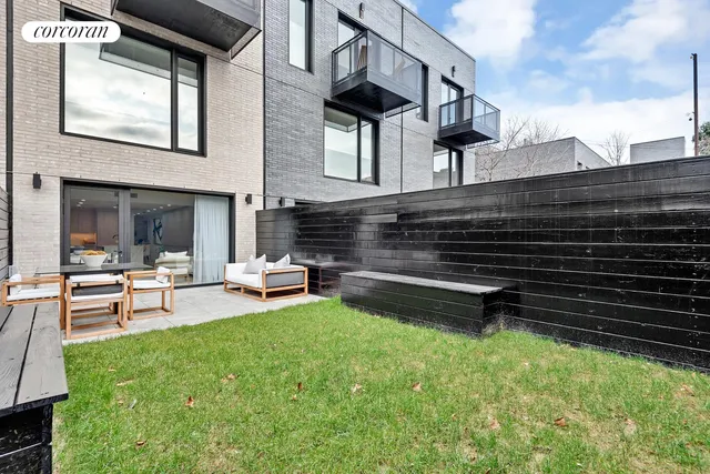 a living room with dining table and chairs