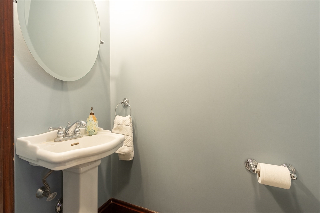 25 Bradford Street Needham, MA 02492 - Photo 18 of 38 a bathroom with a sink and a mirror