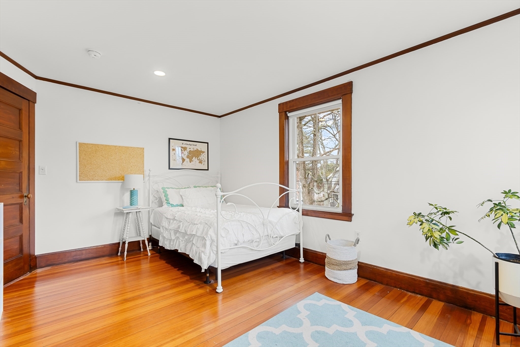 25 Bradford Street Needham, MA 02492 - Photo 22 of 38 a bedroom with a bed and a window
