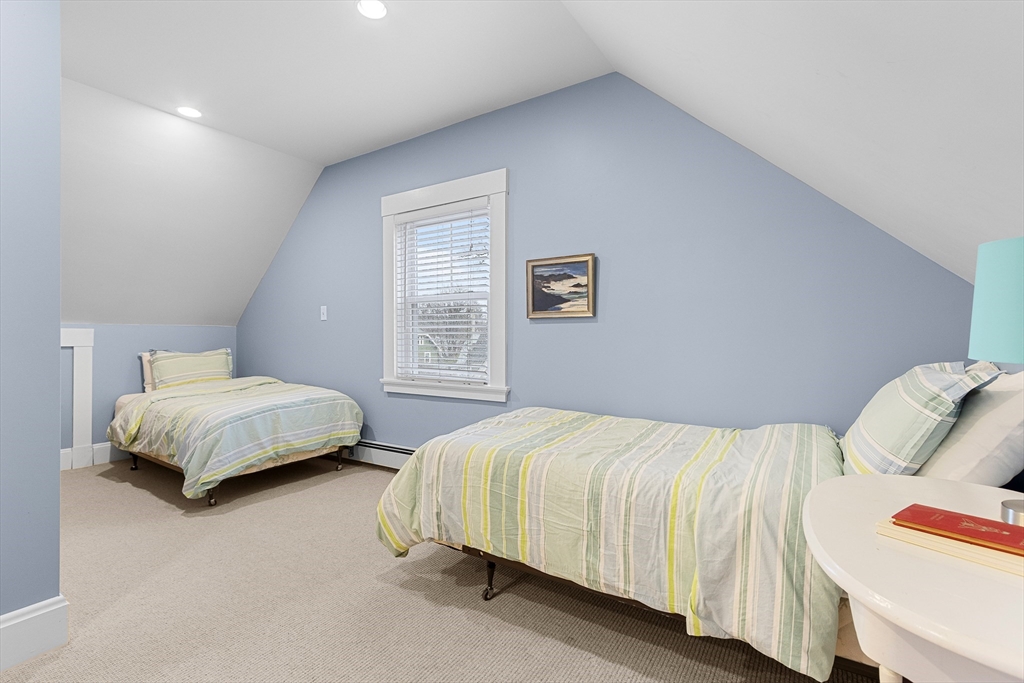 25 Bradford Street Needham, MA 02492 - Photo 31 of 38 a bedroom with a bed and window