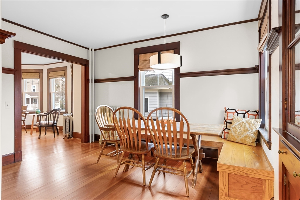 25 Bradford Street Needham, MA 02492 - Photo 9 of 38 a dining room with furniture a chandelier and wooden floor