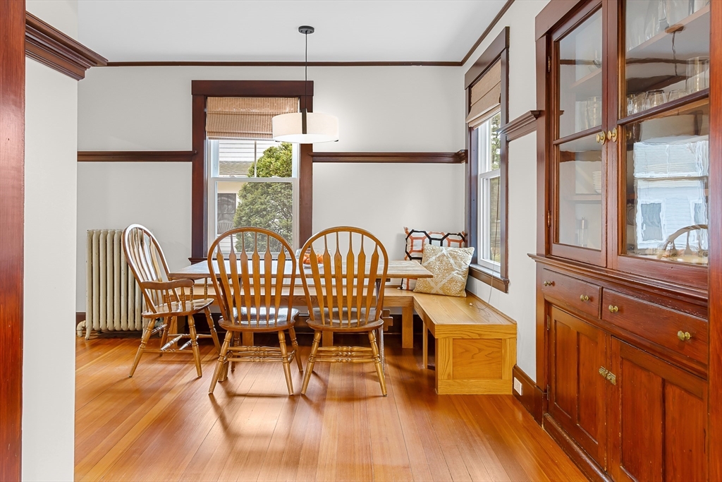 25 Bradford Street Needham, MA 02492 - Photo 10 of 38 a view of a dining room with furniture a chandelier and wooden floor