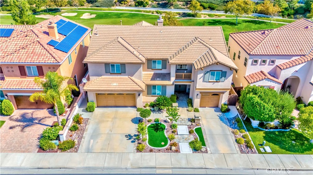 45316 St Tisbury Street Temecula, CA 92592 - Photo 1 of 62 an aerial view of a house with a yard and potted plants