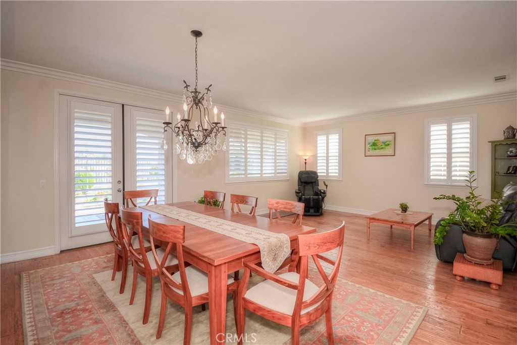 45316 St Tisbury Street Temecula, CA 92592 - Photo 15 of 62 a view of a dining room with furniture window and wooden floor
