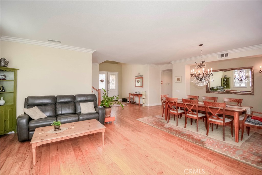 45316 St Tisbury Street Temecula, CA 92592 - Photo 16 of 62 a living room with furniture and wooden floor