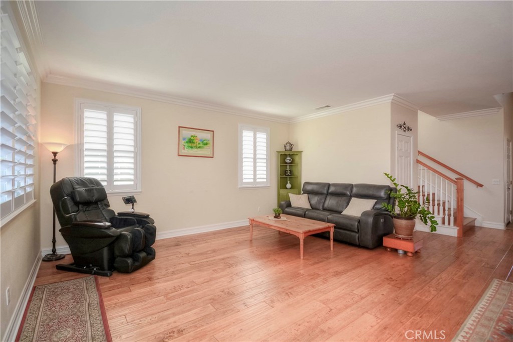 45316 St Tisbury Street Temecula, CA 92592 - Photo 17 of 62 a living room with furniture rug and wooden floor