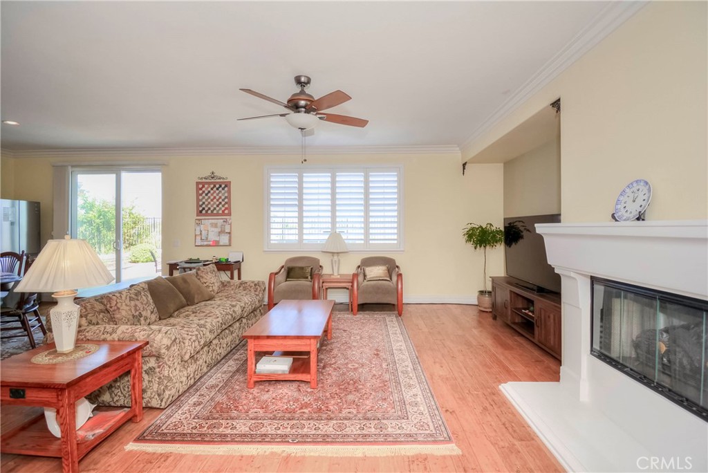 45316 St Tisbury Street Temecula, CA 92592 - Photo 19 of 62 a living room with furniture and a fireplace