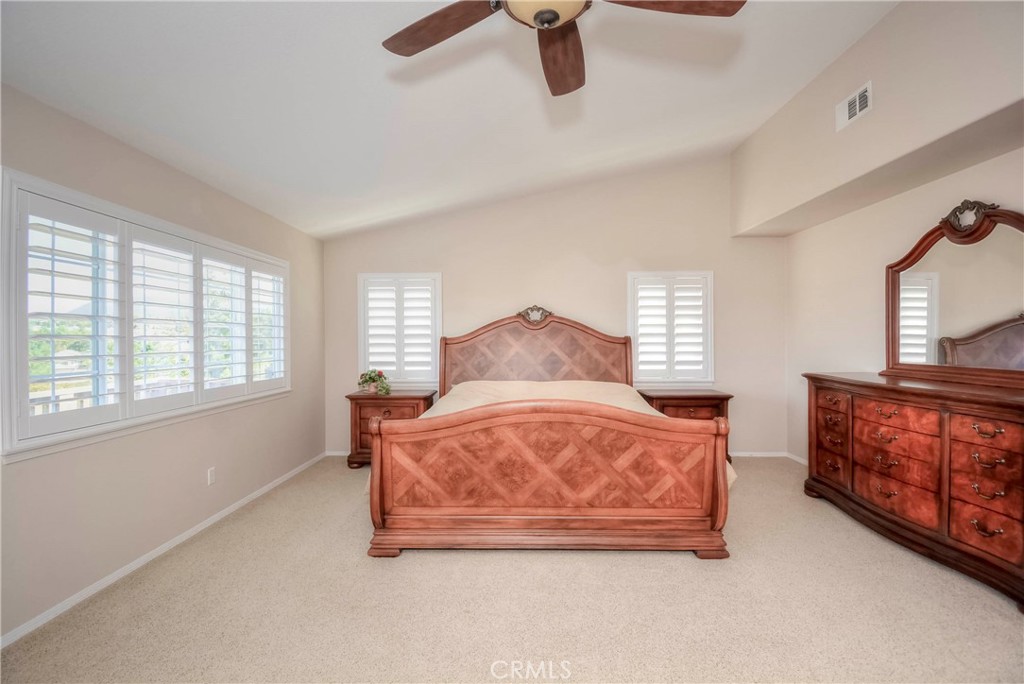 45316 St Tisbury Street Temecula, CA 92592 - Photo 21 of 62 a bedroom with a bed and window