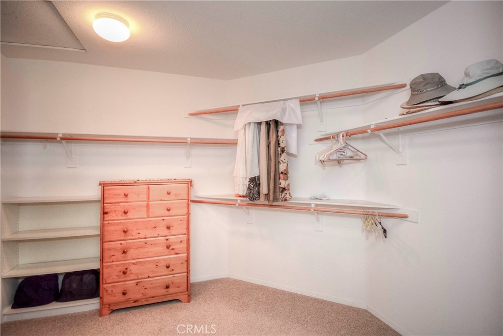 45316 St Tisbury Street Temecula, CA 92592 - Photo 24 of 62 a view of walk in closet with empty racks