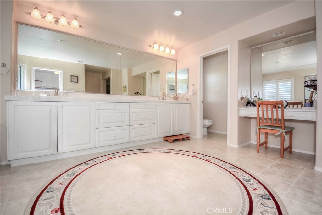 45316 St Tisbury Street Temecula, CA 92592 - Photo 26 of 62 a spacious bathroom with a tub sink and mirror