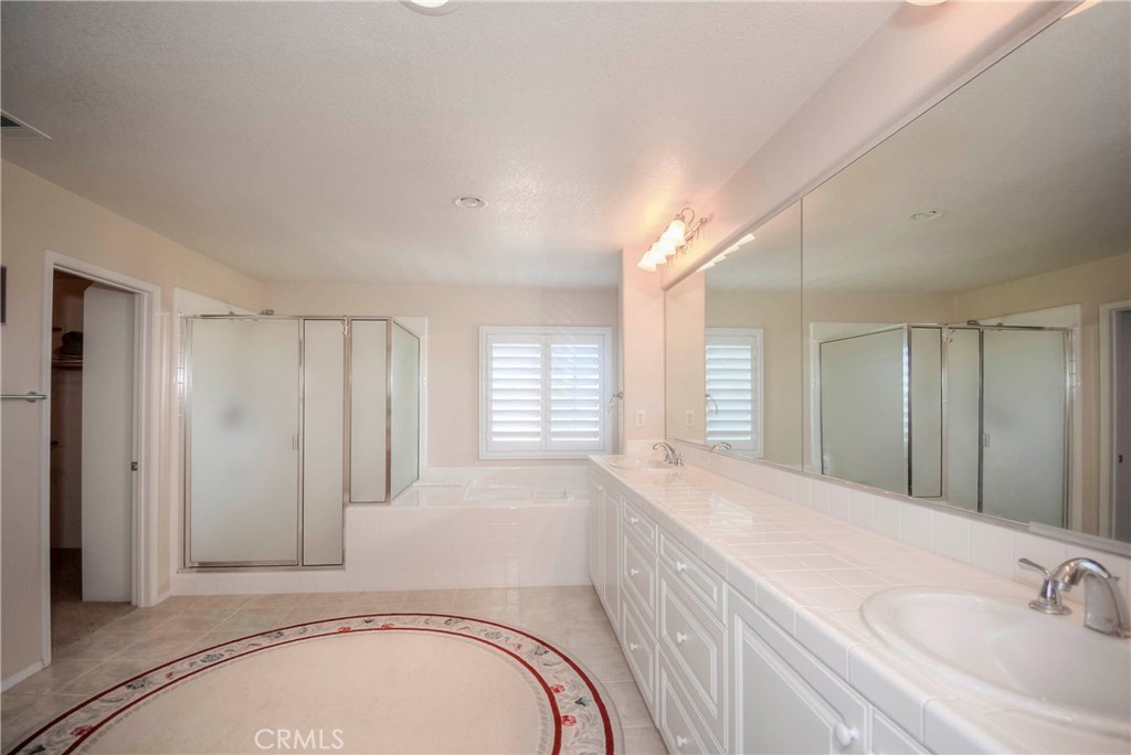45316 St Tisbury Street Temecula, CA 92592 - Photo 29 of 62 a bathroom with a sink and a mirror