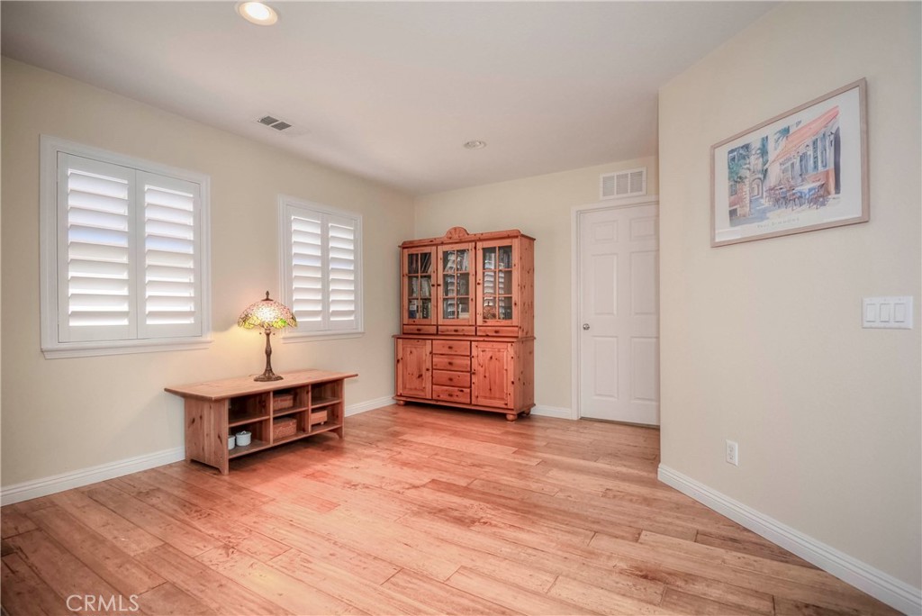45316 St Tisbury Street Temecula, CA 92592 - Photo 33 of 62 a living room with furniture and wooden floor