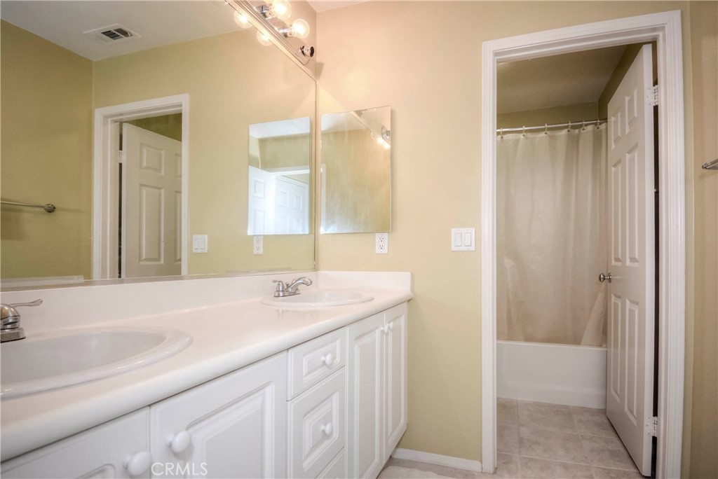 45316 St Tisbury Street Temecula, CA 92592 - Photo 39 of 62 a bathroom with a sink and a mirror
