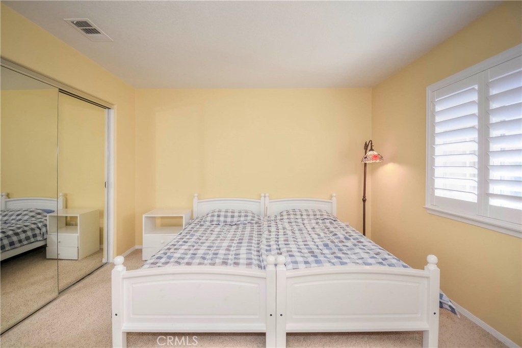 45316 St Tisbury Street Temecula, CA 92592 - Photo 40 of 62 a bedroom with a bed and a window