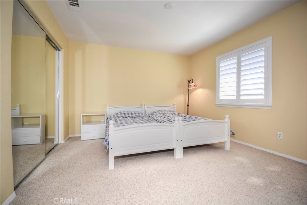 45316 St Tisbury Street Temecula, CA 92592 - Photo 41 of 62 a bedroom with a bed and a table