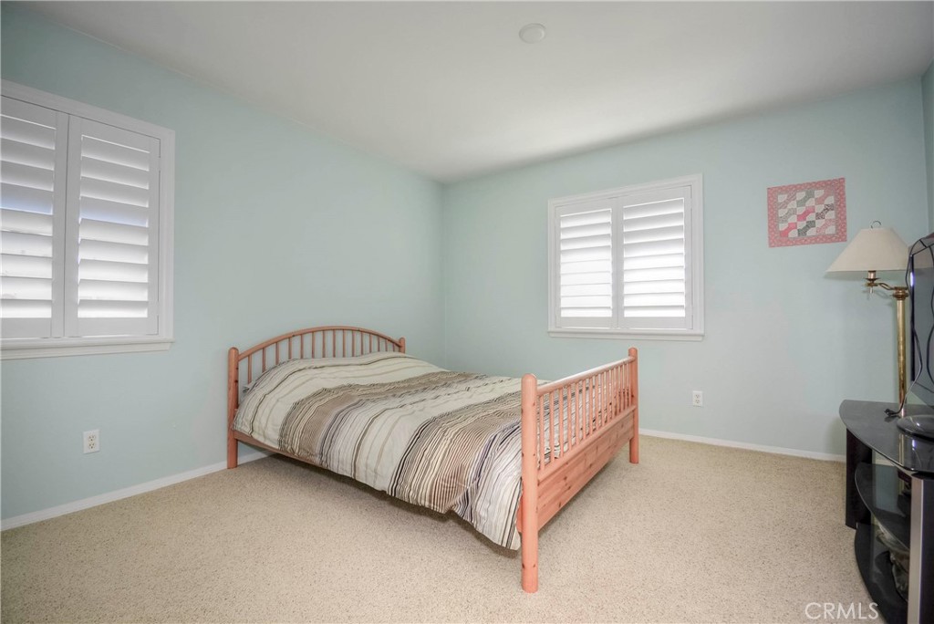 45316 St Tisbury Street Temecula, CA 92592 - Photo 43 of 62 a bed sitting in a bedroom next to a window