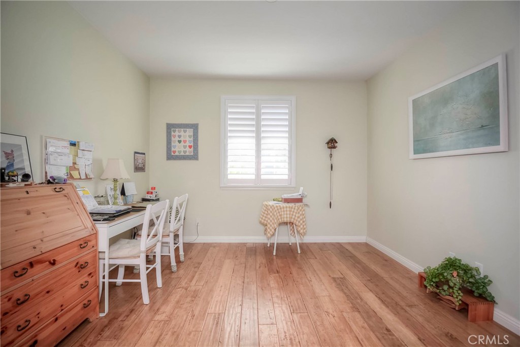45316 St Tisbury Street Temecula, CA 92592 - Photo 47 of 62 a view of a dining room with furniture and wooden floor