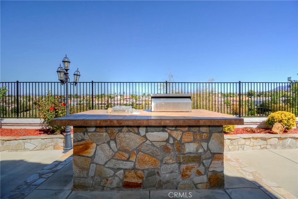 45316 St Tisbury Street Temecula, CA 92592 - Photo 48 of 62 a roof deck with a table and chairs