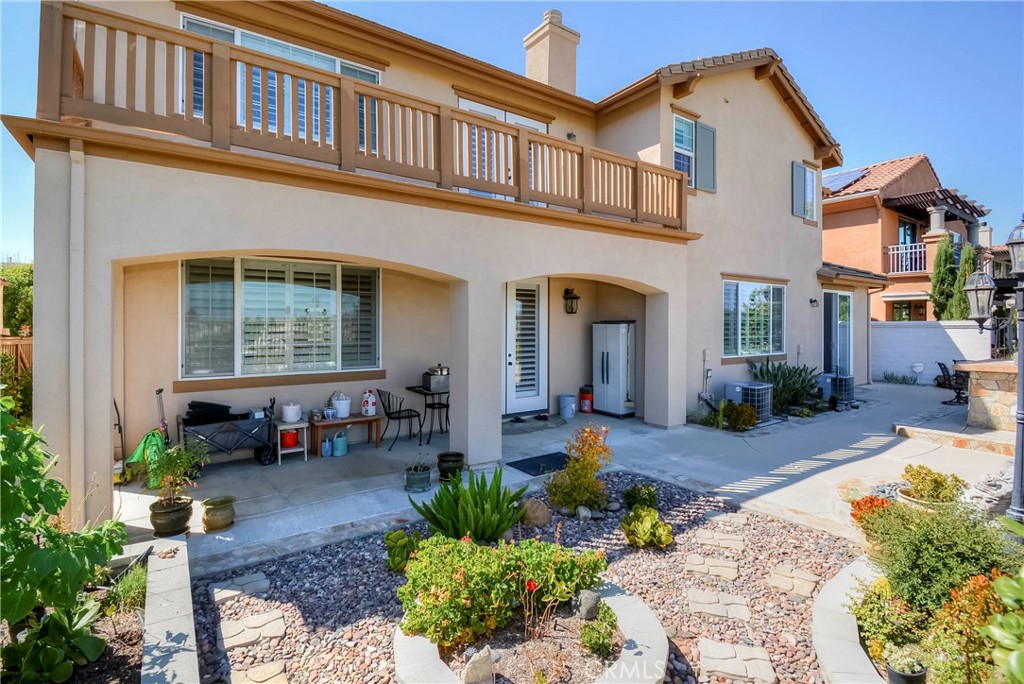 45316 St Tisbury Street Temecula, CA 92592 - Photo 50 of 62 a front view of a house with outdoor seating