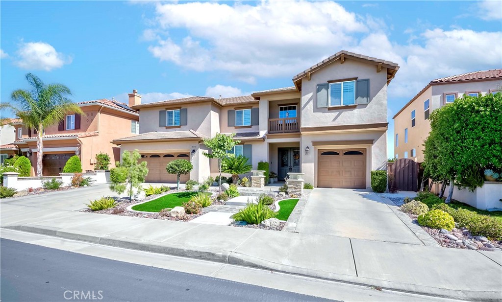 45316 St Tisbury Street Temecula, CA 92592 - Photo 6 of 62 a front view of a house with a yard and outdoor seating