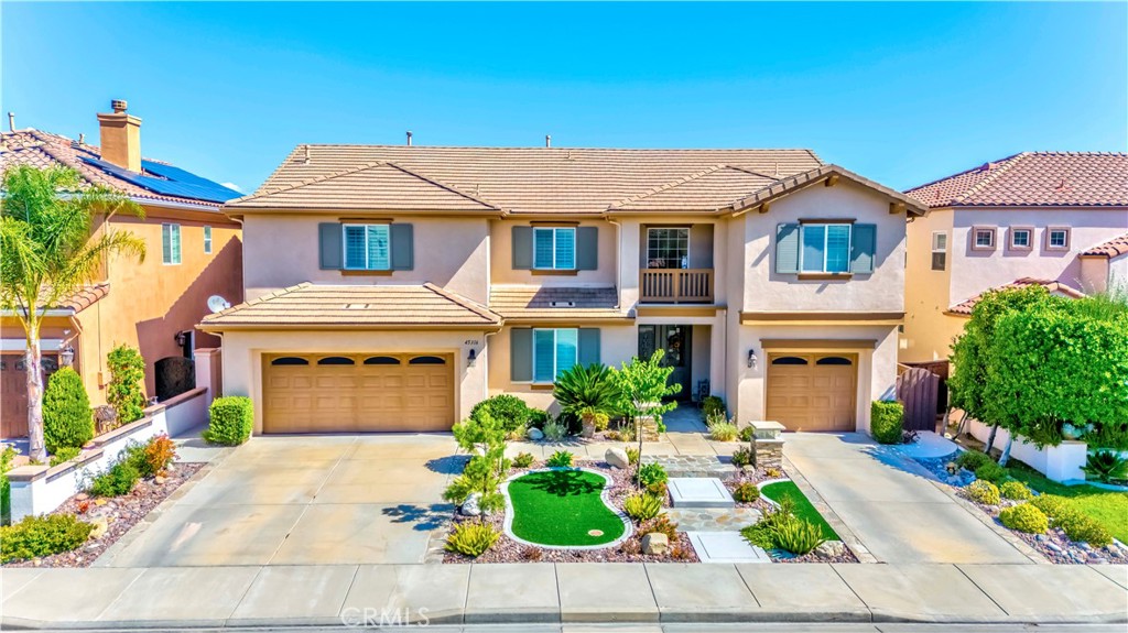 45316 St Tisbury Street Temecula, CA 92592 - Photo 62 of 62 a front view of a house with a garden