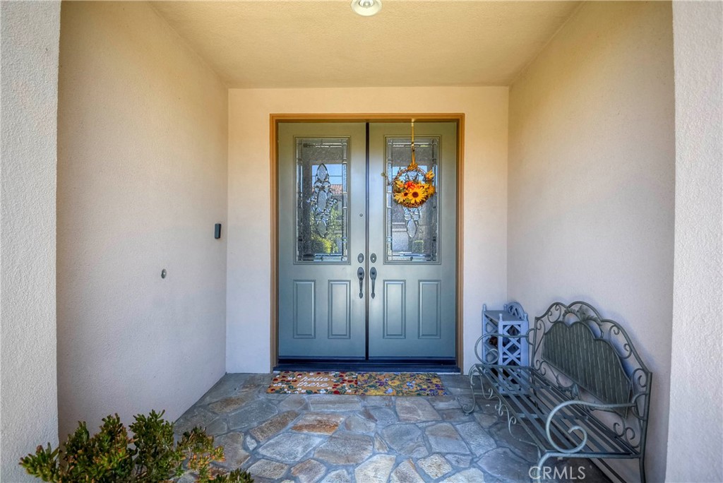 45316 St Tisbury Street Temecula, CA 92592 - Photo 8 of 62 a view of an entryway with wooden floor
